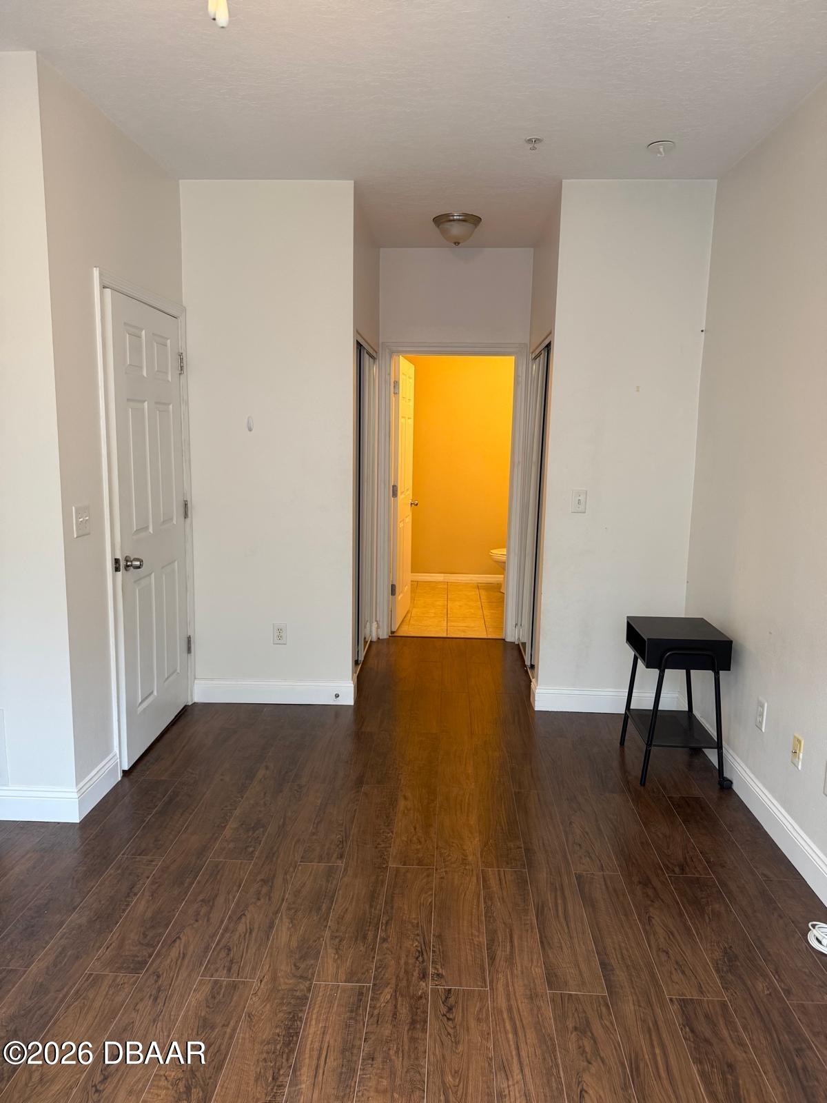 1185 Southwest 9th Road Gainesville, FL 32601 - Photo 6 of 25 a view of a room with wooden floor and a window