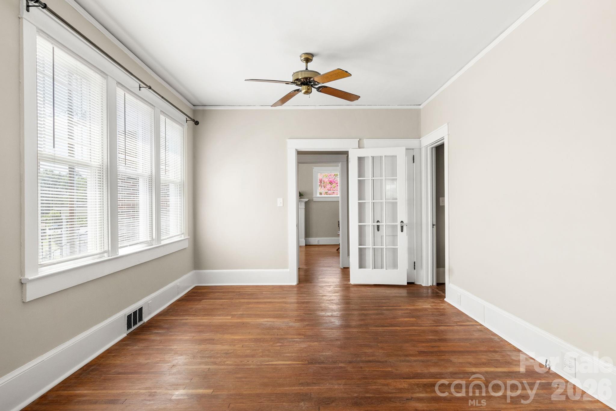 108 Reedy Street Chester, SC 29706 - Photo 31 of 42 a view of empty room with wooden floor and fan
