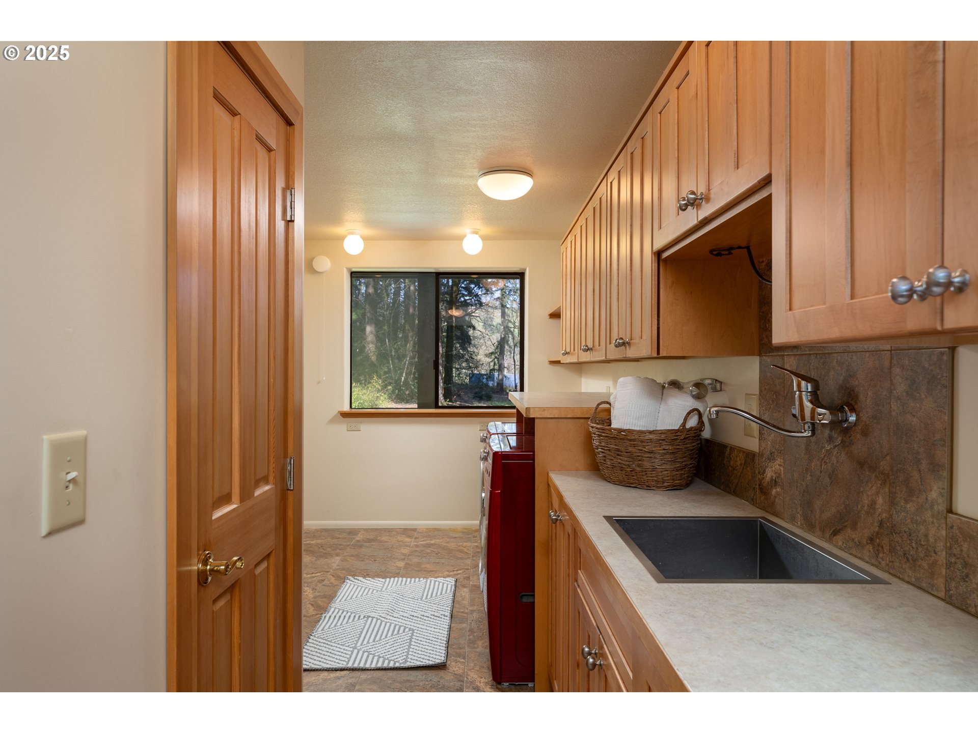 19855 Northeast Trunk Road Dundee, OR 97115 - Photo 17 of 45 a kitchen with a sink cabinets and a window
