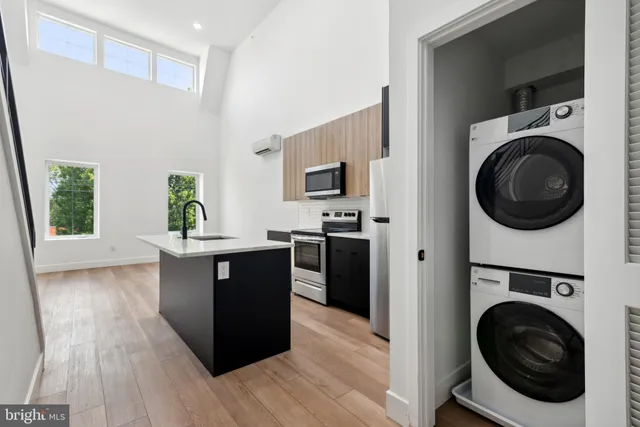 a view of a kitchen with washer and dryer