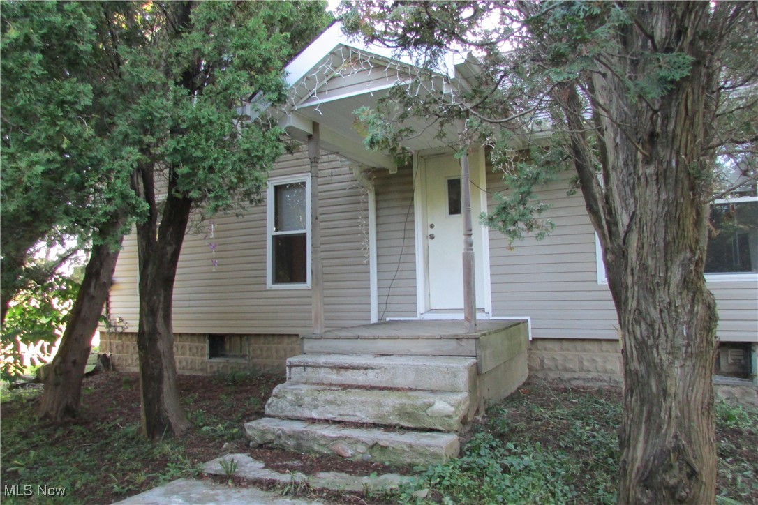 15401 A Madison Road Middlefield, OH 44062 - Photo 1 of 17 View of front facade featuring a porch