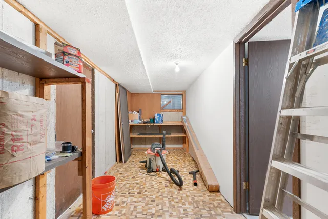 a view of living room with furniture and a rug