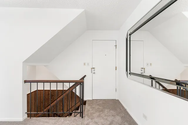 a view of a hallway with a view of a living room