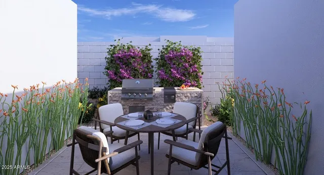 a view of a chairs and table in the backyard