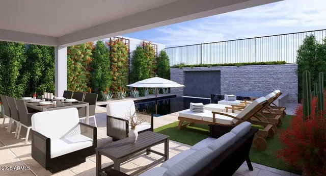 a view of a patio with a dining table and chairs under an umbrella with a ceiling fan