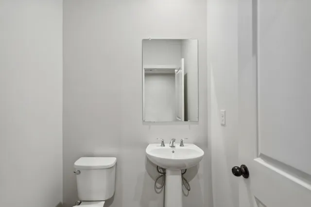 a bathroom with a sink and toilet