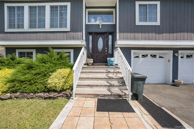 a view of a street that has couple of cars parked on road