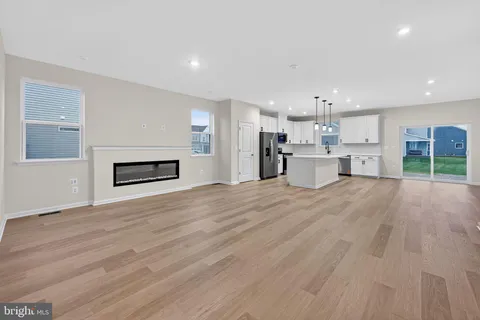 a view of a kitchen with a sink and a stove top oven