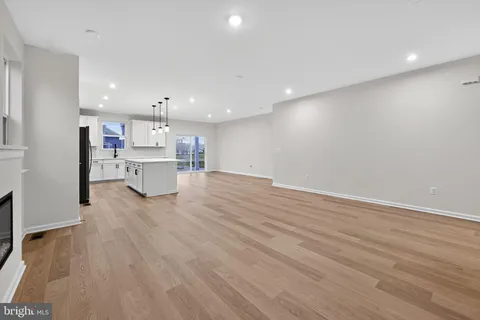 a view of kitchen with wooden floor