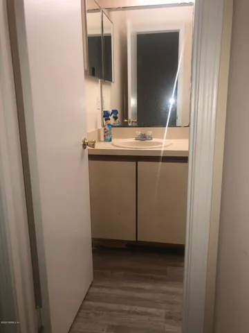 a bathroom with a sink and a mirror