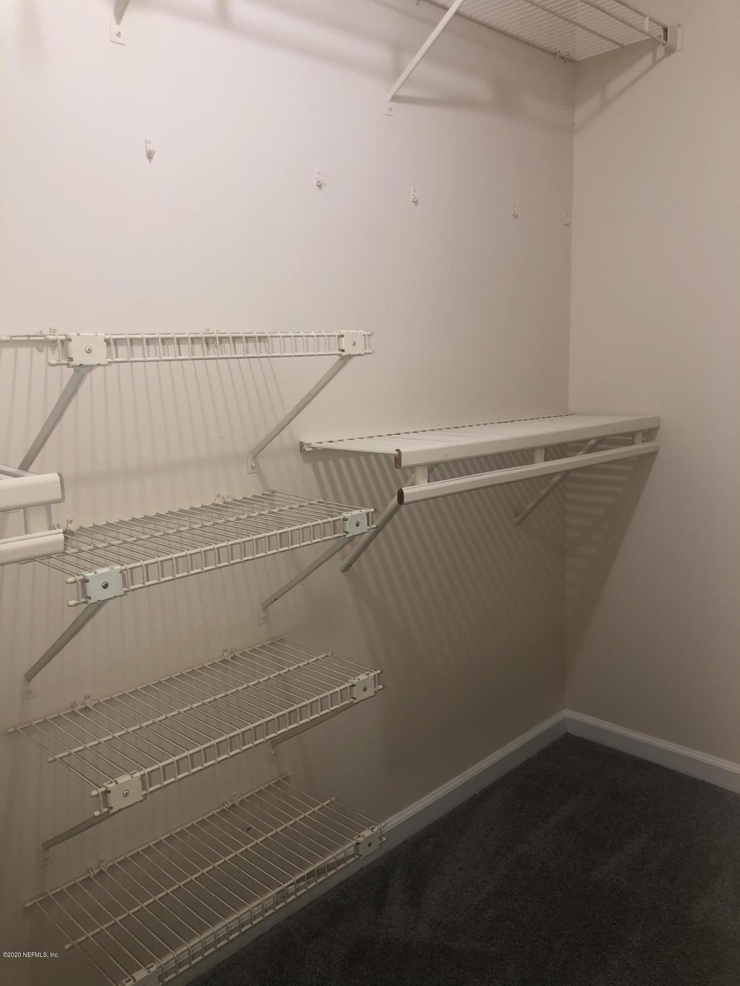 141 Jasmine Street Atlantic Beach, FL 32233 - Photo 17 of 23 a view of small space with racks on the wall