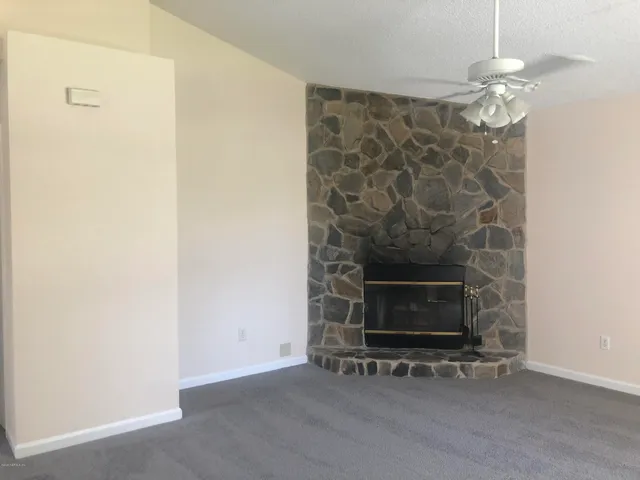 an empty room with a fireplace