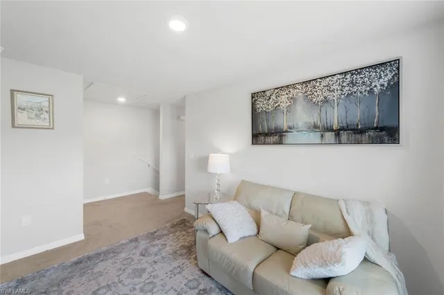 a living room with furniture and a couch