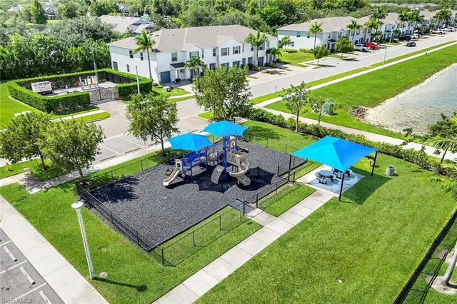 an aerial view of a house with a garden and swimming pool