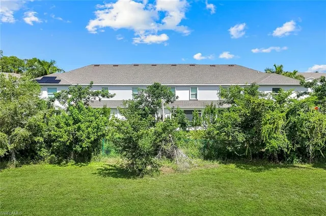 a view of a house with a garden
