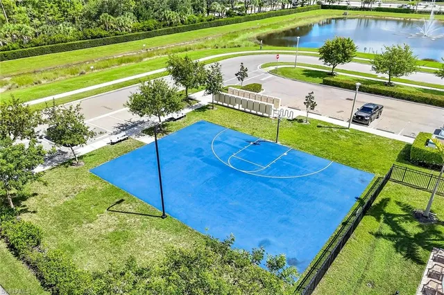 a view of a swimming pool with a yard
