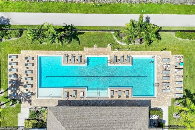 a kitchen with sink a microwave and cabinets