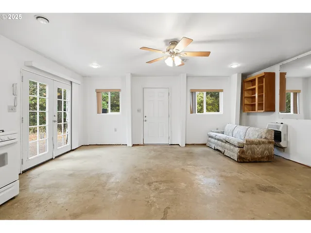 a bathroom with a granite countertop sink a toilet and shower