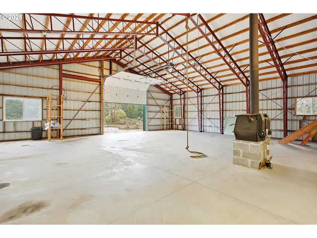 a view of a kitchen with a sink cabinets and a ceiling fan