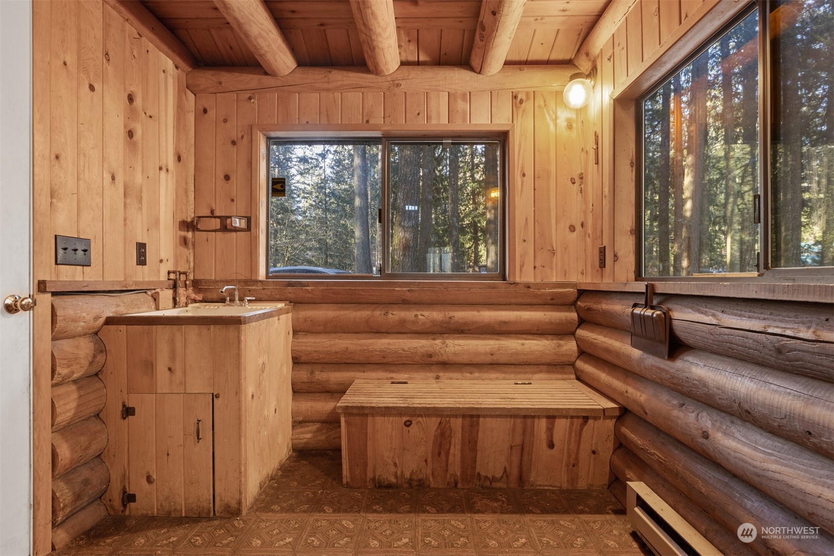 7527 Cemetery Road Maple Falls, WA 98266 - Photo 12 of 40 a bathroom with a granite countertop sink and a large window
