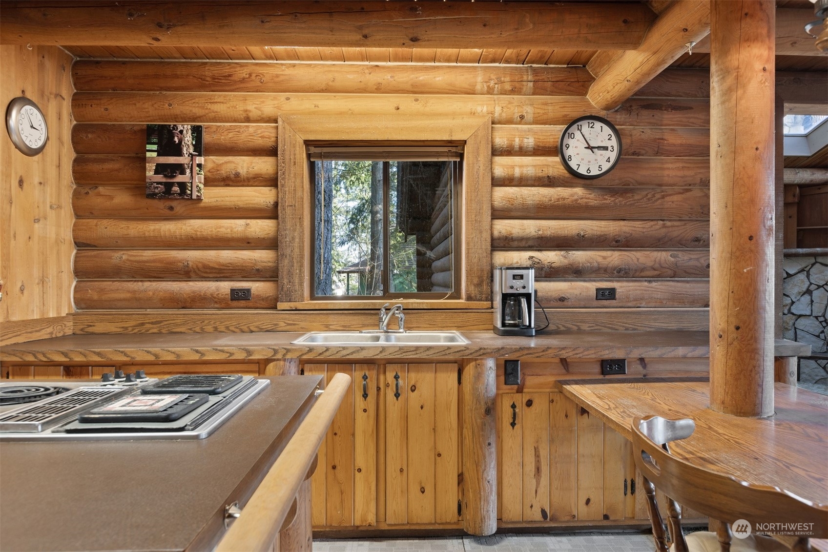 7527 Cemetery Road Maple Falls, WA 98266 - Photo 16 of 40 a view of a kitchen with a sink and a clock