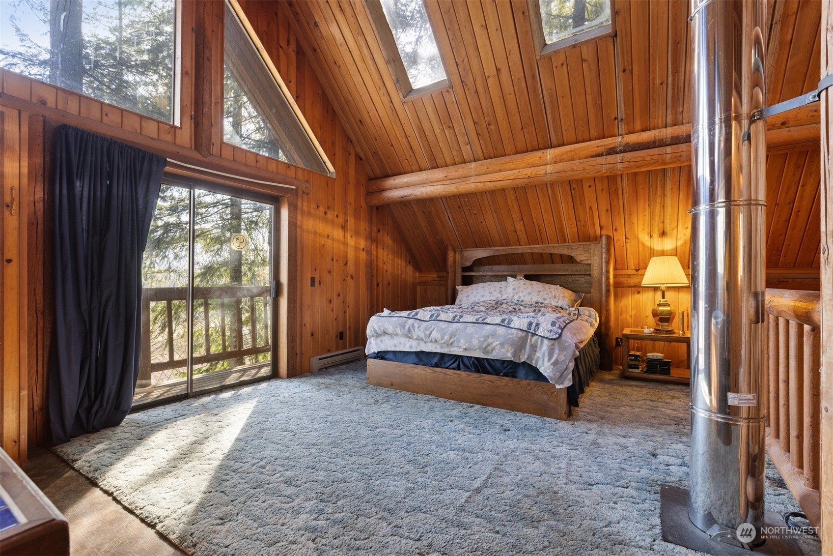 7527 Cemetery Road Maple Falls, WA 98266 - Photo 31 of 40 a bedroom with a bed and a window