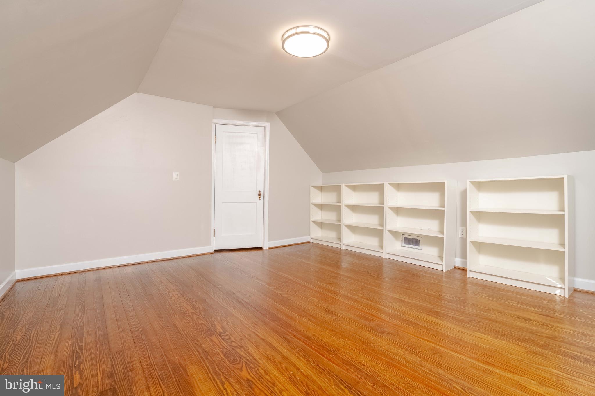 7012 Dunhill Road Dundalk, MD 21222 - Photo 19 of 38 wooden floor in an empty room with a window