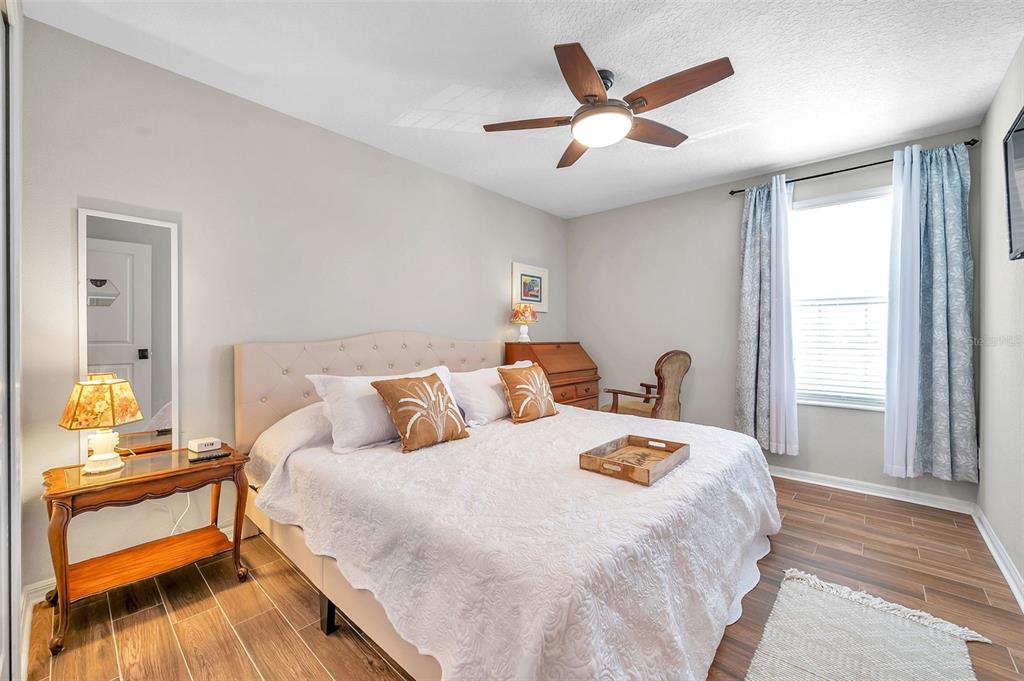 3737 Copperspring Boulevard New Port Richey, FL 34653 - Photo 11 of 61 a bedroom with bed and window