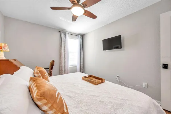 a bedroom with two beds and a large window