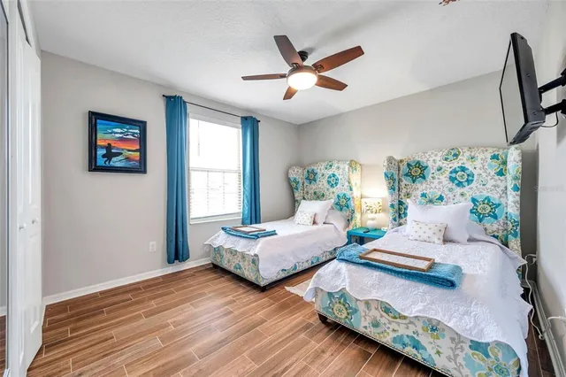 a bedroom with bed and window