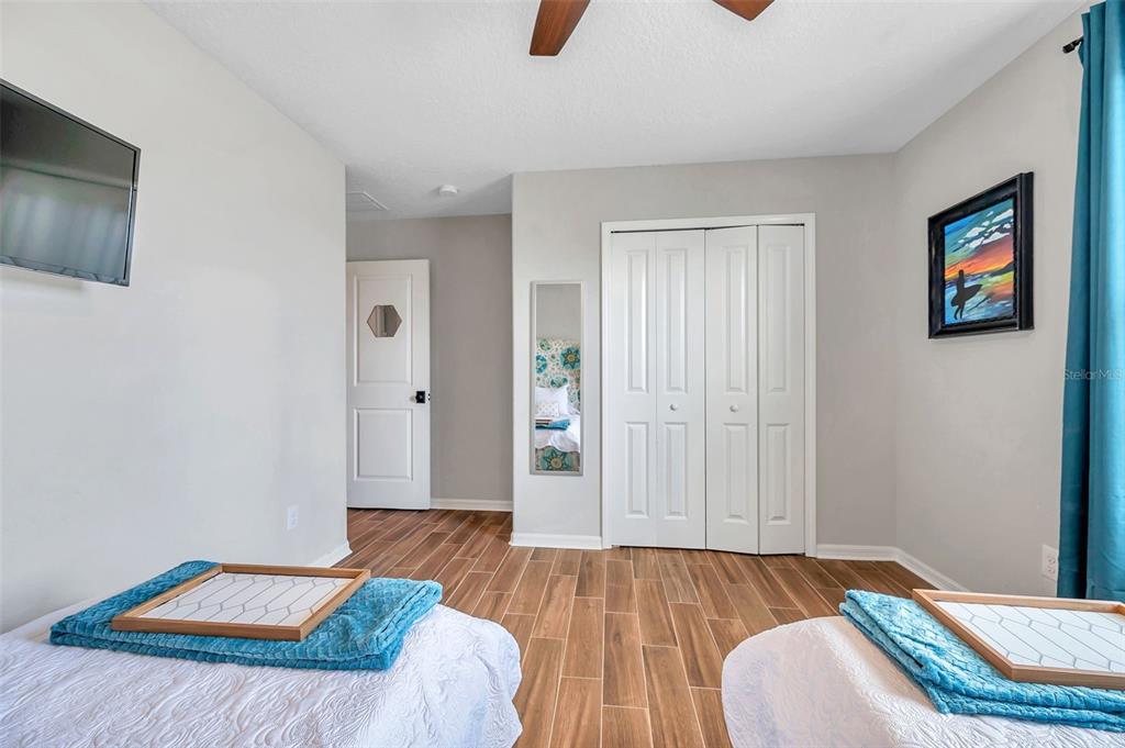 3737 Copperspring Boulevard New Port Richey, FL 34653 - Photo 18 of 61 a bedroom with bed and window