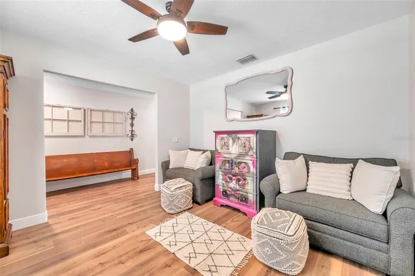 a bedroom with furniture and a window