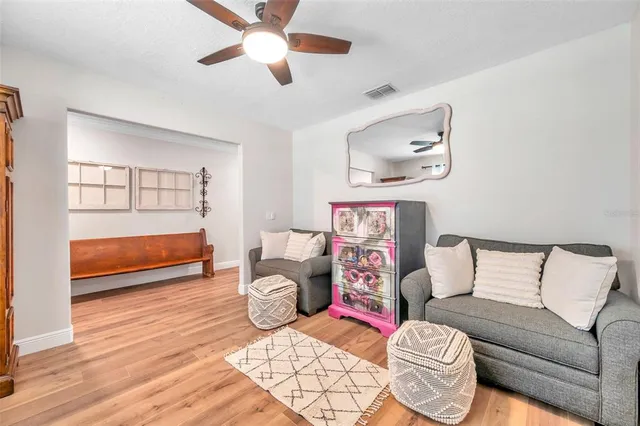 a bedroom with furniture and a window