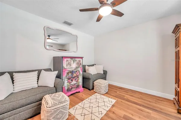 a bedroom with furniture and a window