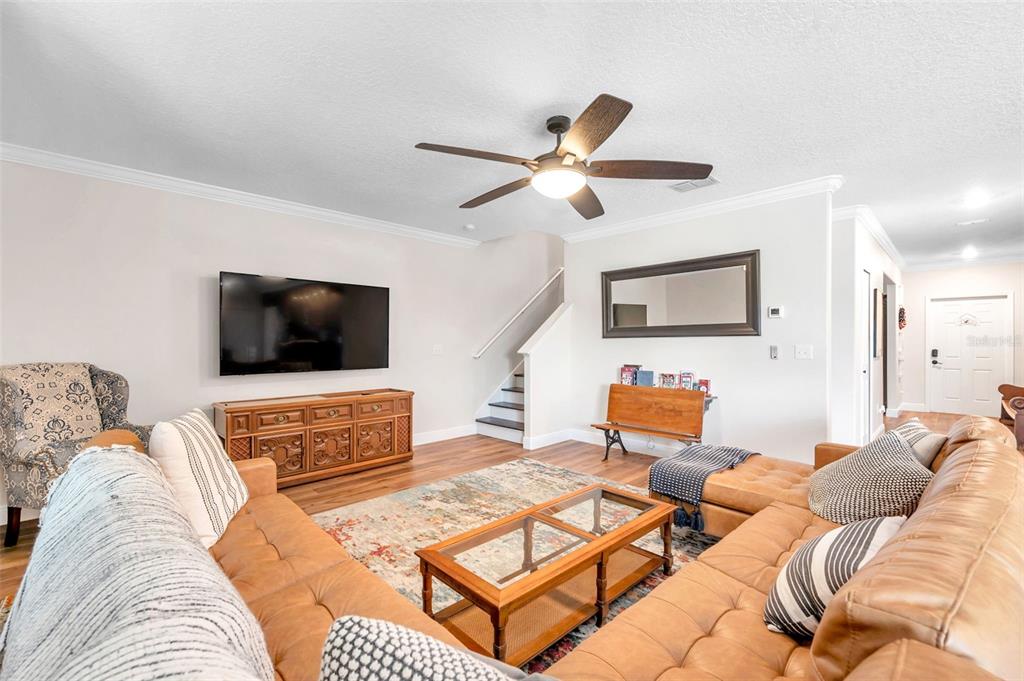 3737 Copperspring Boulevard New Port Richey, FL 34653 - Photo 25 of 61 a living room with furniture and a flat screen tv