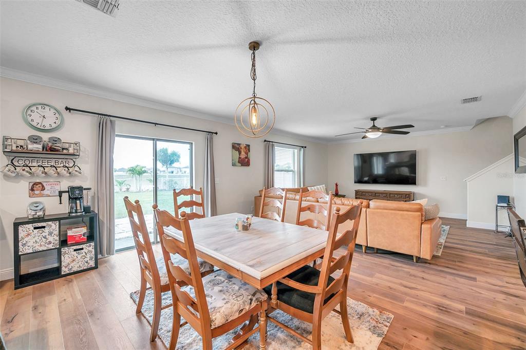 3737 Copperspring Boulevard New Port Richey, FL 34653 - Photo 42 of 61 a view of a dining room with furniture window and wooden floor