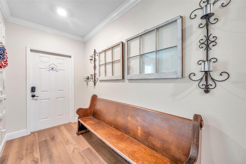 3737 Copperspring Boulevard New Port Richey, FL 34653 - Photo 44 of 61 a hallway with a couch and a window