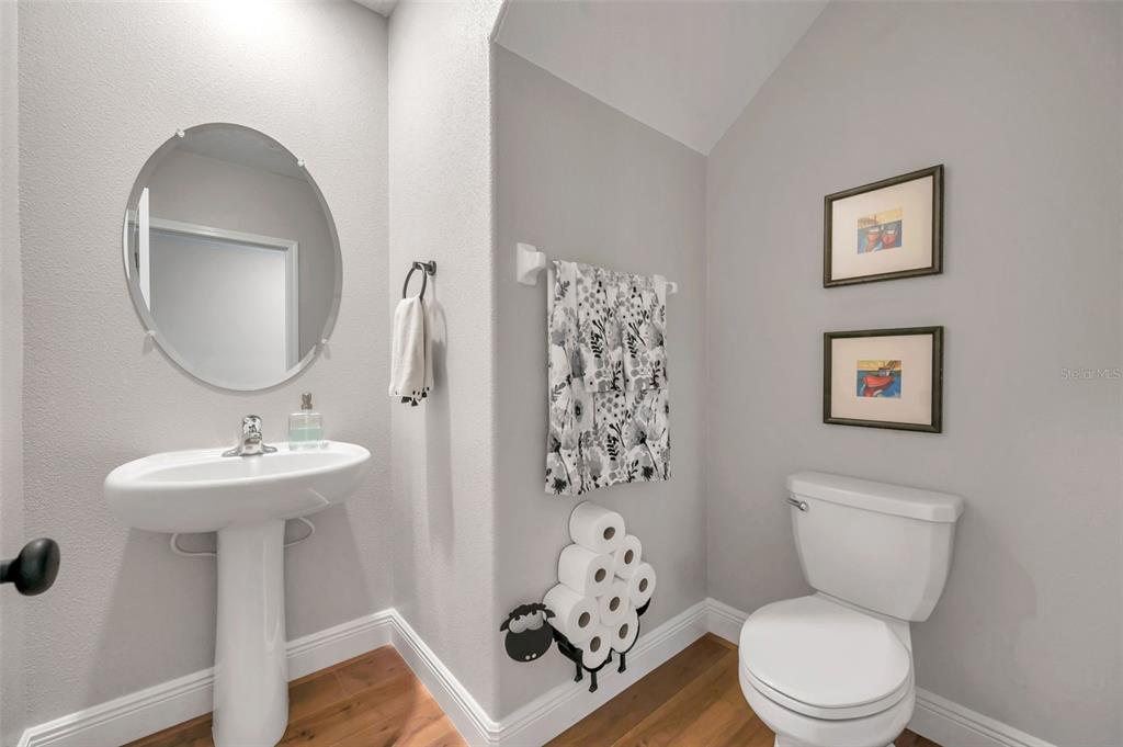 3737 Copperspring Boulevard New Port Richey, FL 34653 - Photo 47 of 61 a bathroom with a toilet sink and mirror