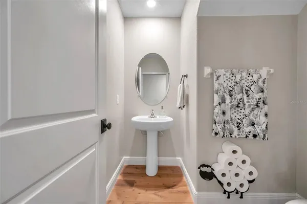 an aerial view of a swimming pool with outdoor seating and garden