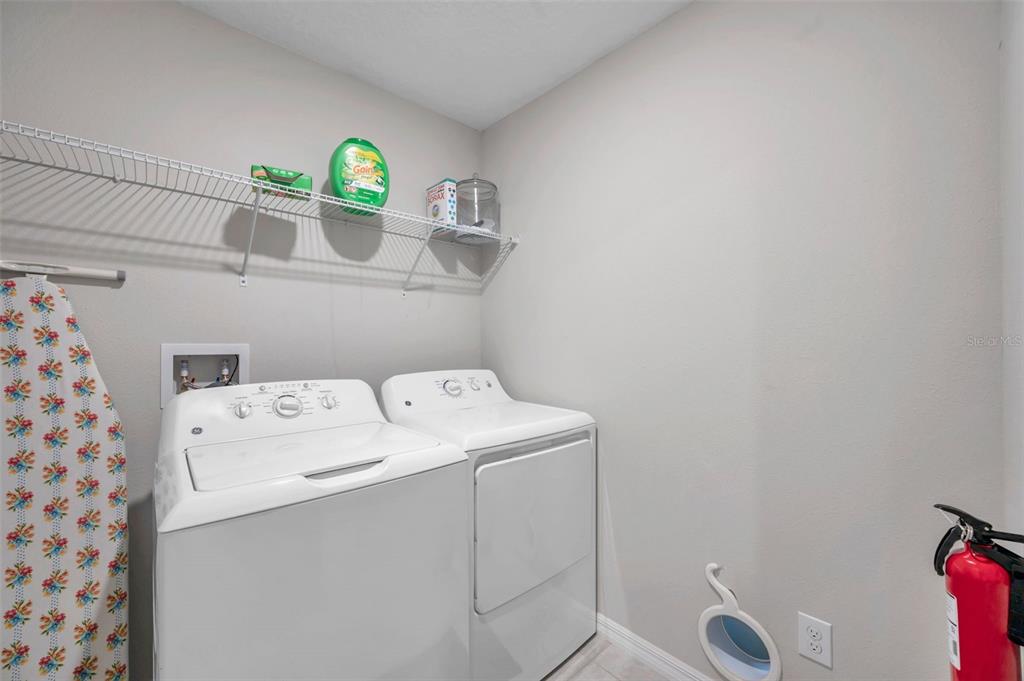 3737 Copperspring Boulevard New Port Richey, FL 34653 - Photo 55 of 61 a utility room with dryer and washer