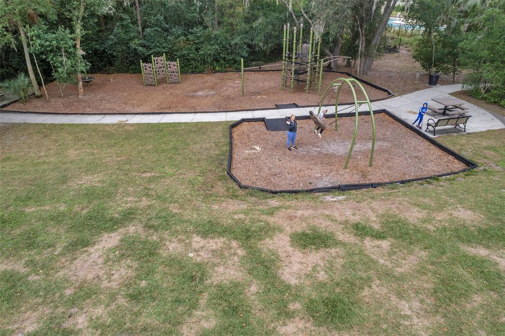 3737 Copperspring Boulevard New Port Richey, FL 34653 - Photo 61 of 61 a view of a swimming pool with a sitting space