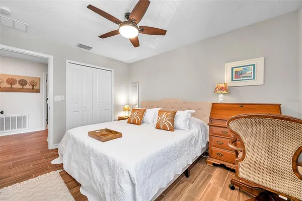 a bedroom with bed and window