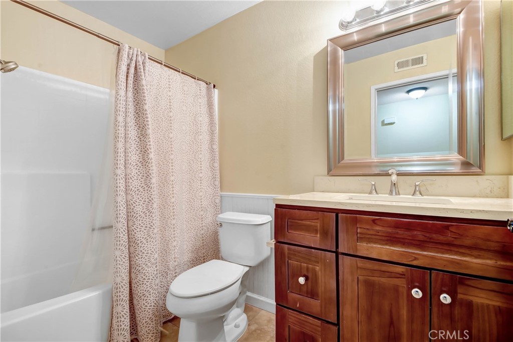 7858 Peralta Road Rancho Cucamonga, CA 91730 - Photo 11 of 14 a bathroom with a sink a toilet and shower