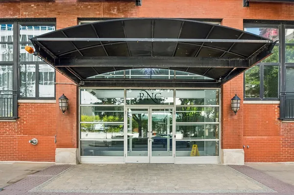 a black and white building with a outdoor space