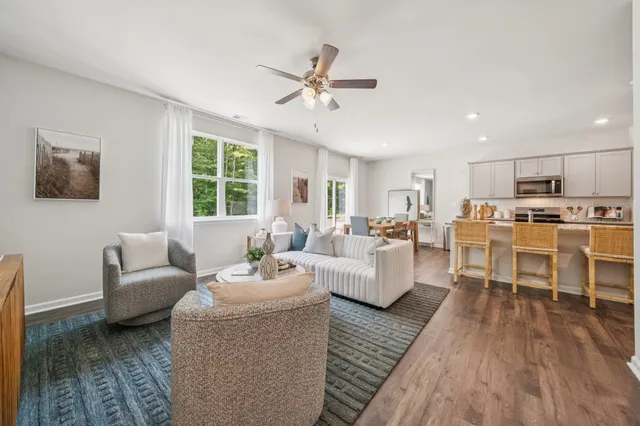 a living room with furniture and a large window