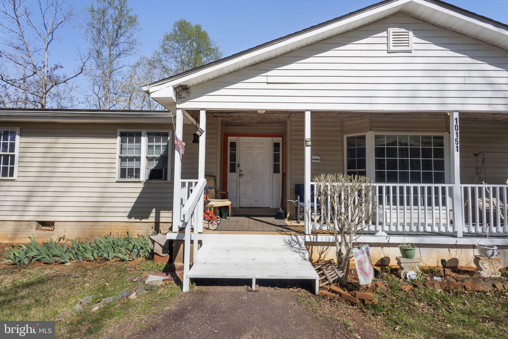 a view of a house with wooden fence
