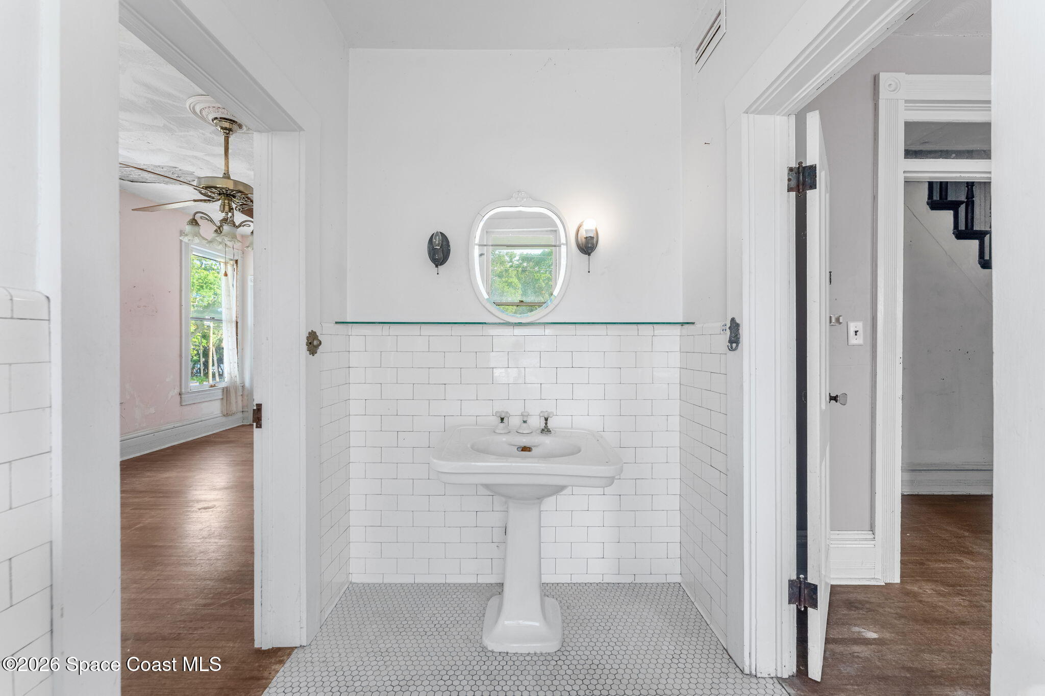 1101 Rockledge Drive Rockledge, FL 32955 - Photo 36 of 76 a bathroom with a sink and a mirror