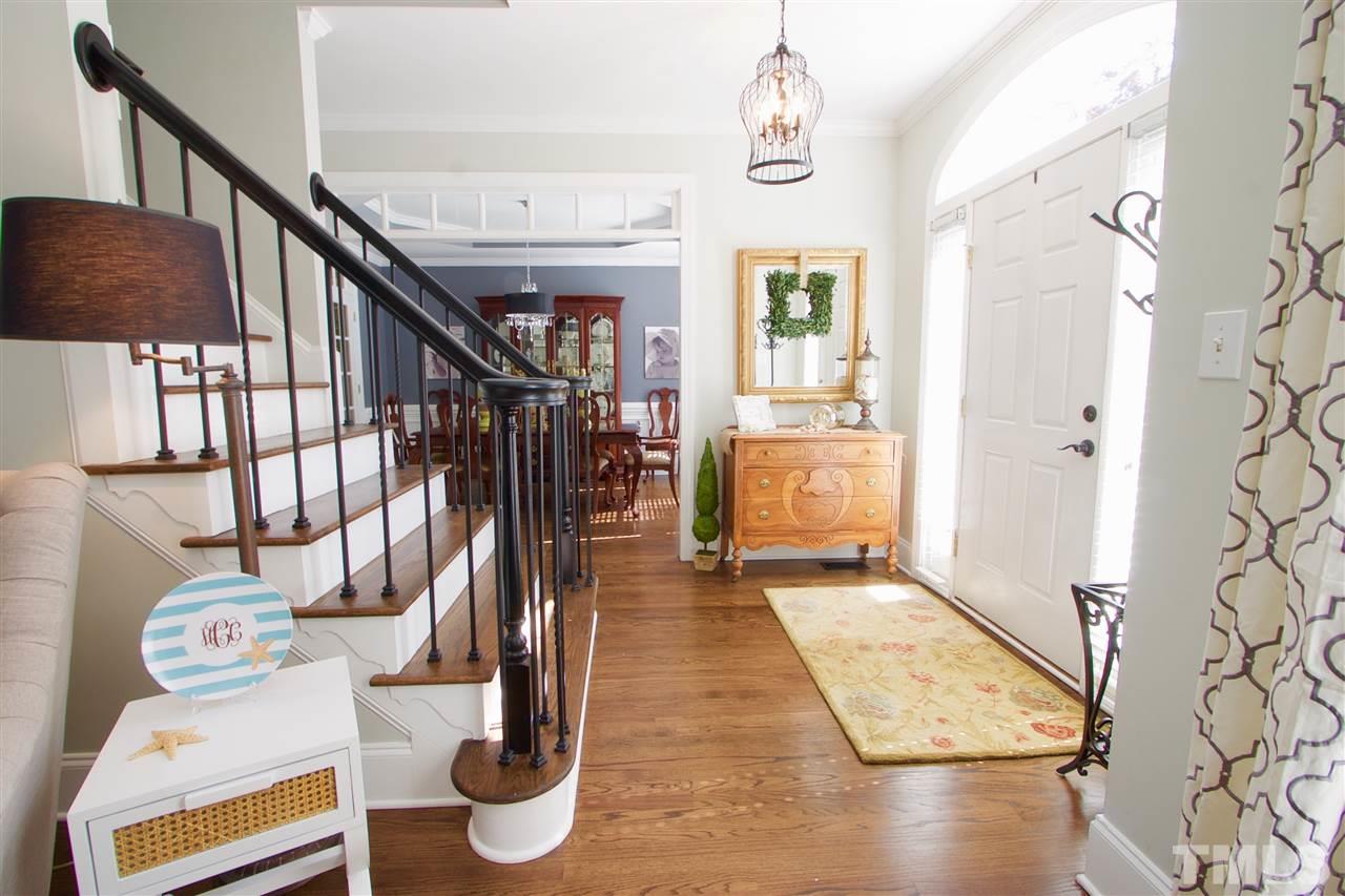 8208 Gadsen Court Raleigh, NC 27613 - Photo 3 of 25 a view of entryway and hall with wooden floor