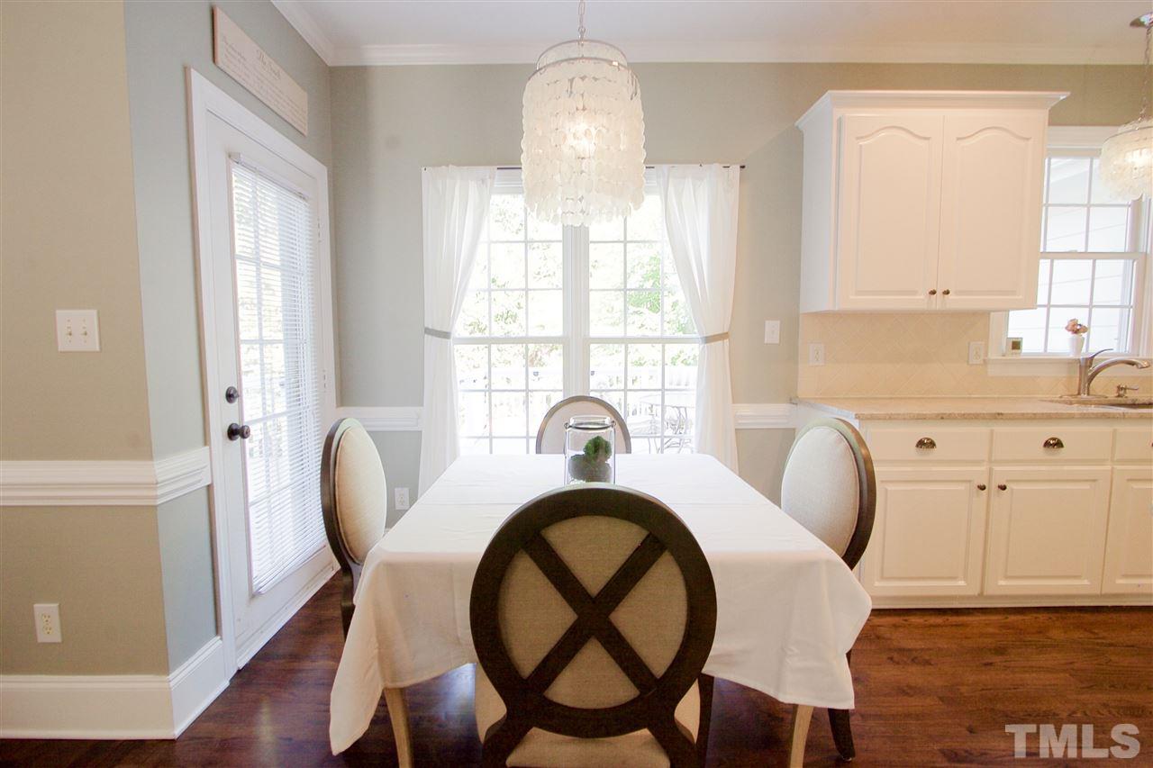 8208 Gadsen Court Raleigh, NC 27613 - Photo 8 of 25 a view of a dining room with furniture and a window