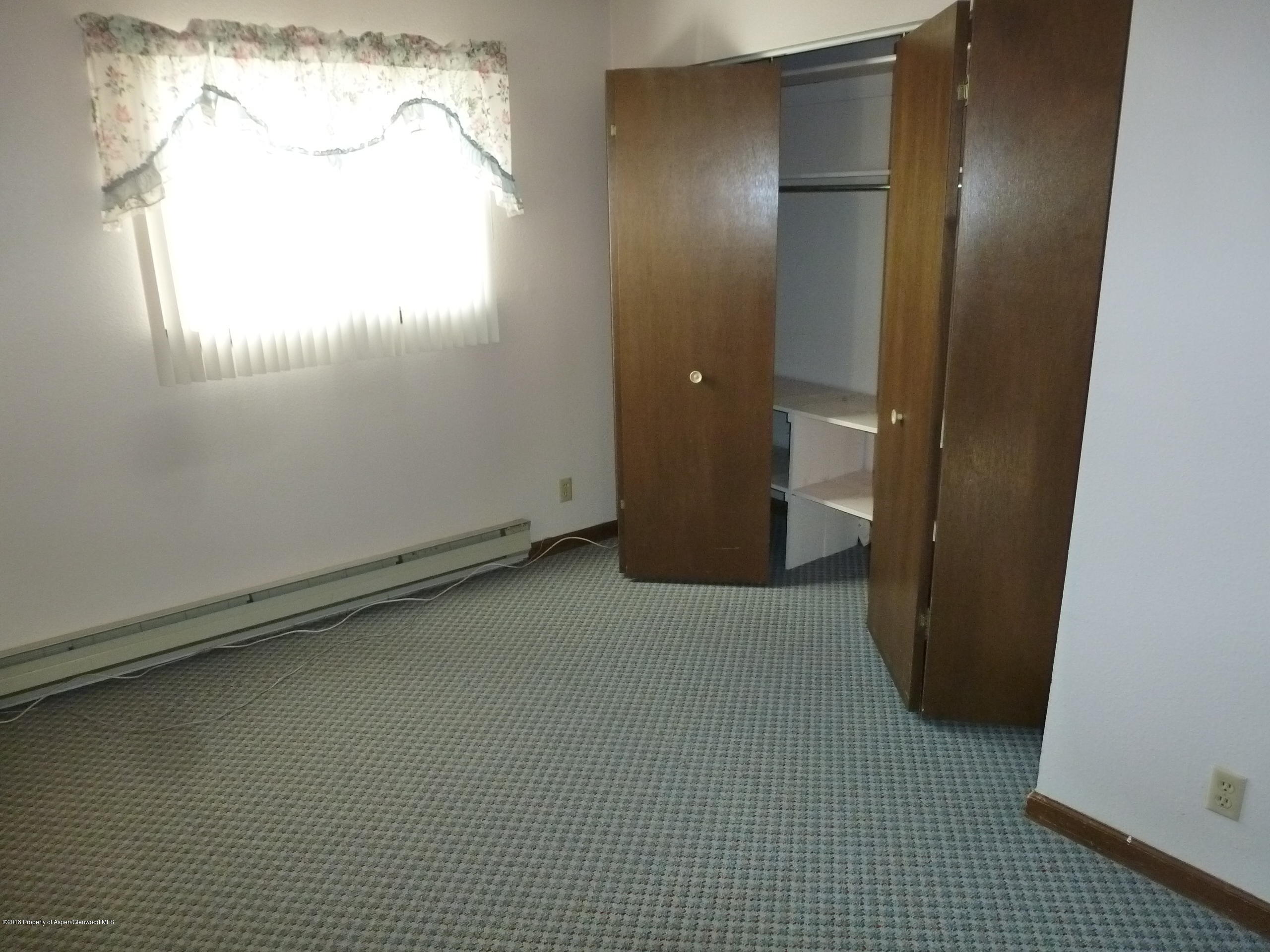 810 East 5th Street Rifle, CO 81650 - Photo 12 of 13 an empty room with a window